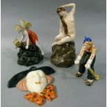 Four 1930's/40's pottery figures including a wall face mask with broad rimmed black hat, orange
