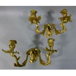 A pair of gilt metal acanthus twin sconce wall lights