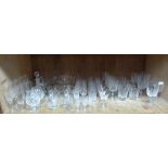 A large quantity of cut glass ware including whisky tumblers, wines, bowls, etc