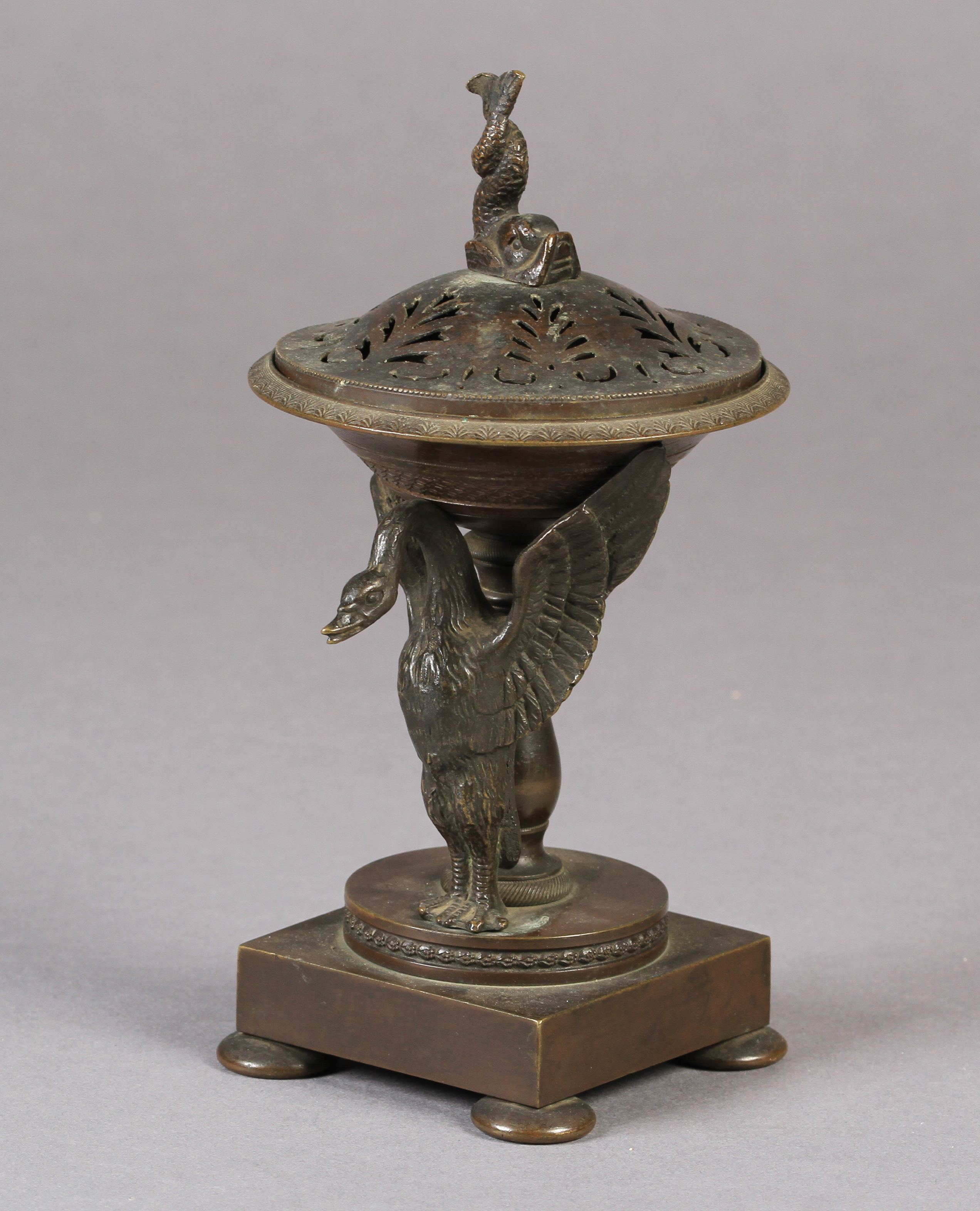 A small 19th century bronze brazier of shallow urn form on a pedestal base, the single swan mount