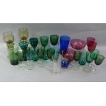 A quantity of Victorian and later coloured glass including green glass wines, beakers, cranberry