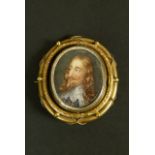 A Victorian swiveling brooch in pinchbeck collet set with a miniature portrait of Charles I within a