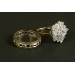 A cluster ring in 9ct gold claw set with circular faceted cubic zirconia, together with an