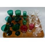 A quantity of Victorian and later glasses including, green glass wines, cranberry glass wines,