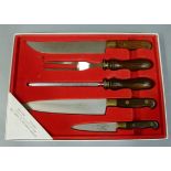 A Joseph Rodgers and Sons Ltd five piece knife set including carving knife, fork and steel in