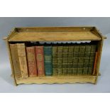 An oak miniature bookshelf of peg construction, together with a set of Scotts Poetical Works and