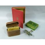 A Terry's Sweet Thoughts simulated book box; together with a WD & HO Wills tin, a pair of cased hair