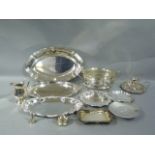 A quantity of silver plated ware including trays, dishes, chamberstick, tea strainer etc