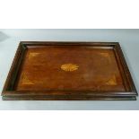 A mahogany stained rectangular tray with moulded gallery, the centre with shaded oval, conforming