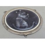 A silver and amethyst enamelled St Christopher dashboard badge, circular 5.5cm diameter