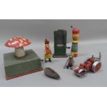 A Shuco push-a-long mouse, clockwork rabbit and acrobat mouse and a German tinplate cabinet with
