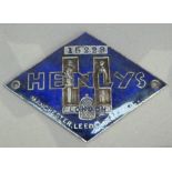A 1930s Henly's London, Manchester, Leeds & Bristol dealership dashboard badge No. 15228, blue