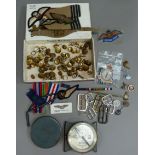 A collection of RAF buttons, cap badges and insignia together with a WWII German First