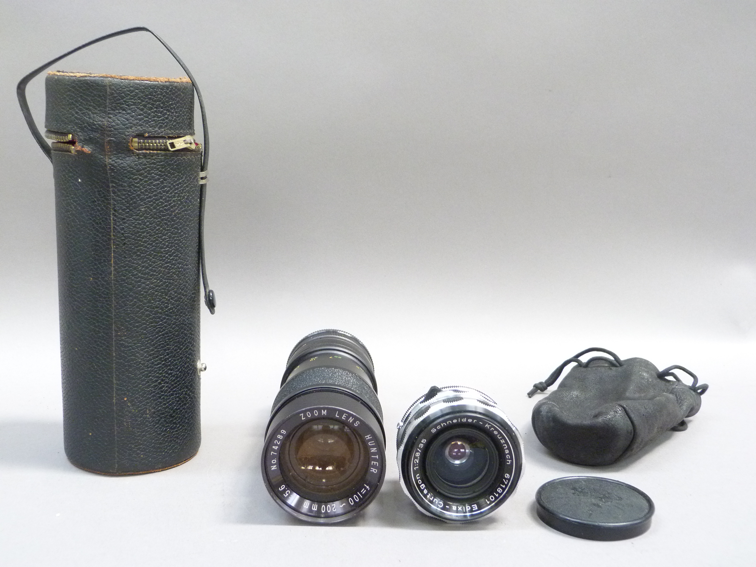 Zoom lens Hunter (Japan) 200mm No. 74289 in leather carry case and a Schneider-Kreuznach (German)