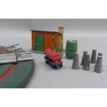 A Hornby O gauge turntable, a plate layer's hut, six milk churns and a Hornby shell tanker