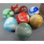 A set of six vintage white and single colour opaque glass marbles (possibly Akro), two translucent