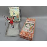 A Japanese 'Wonder Acrobat' and a mechanical Marionette Theatre, trade mark CK, in original boxes (