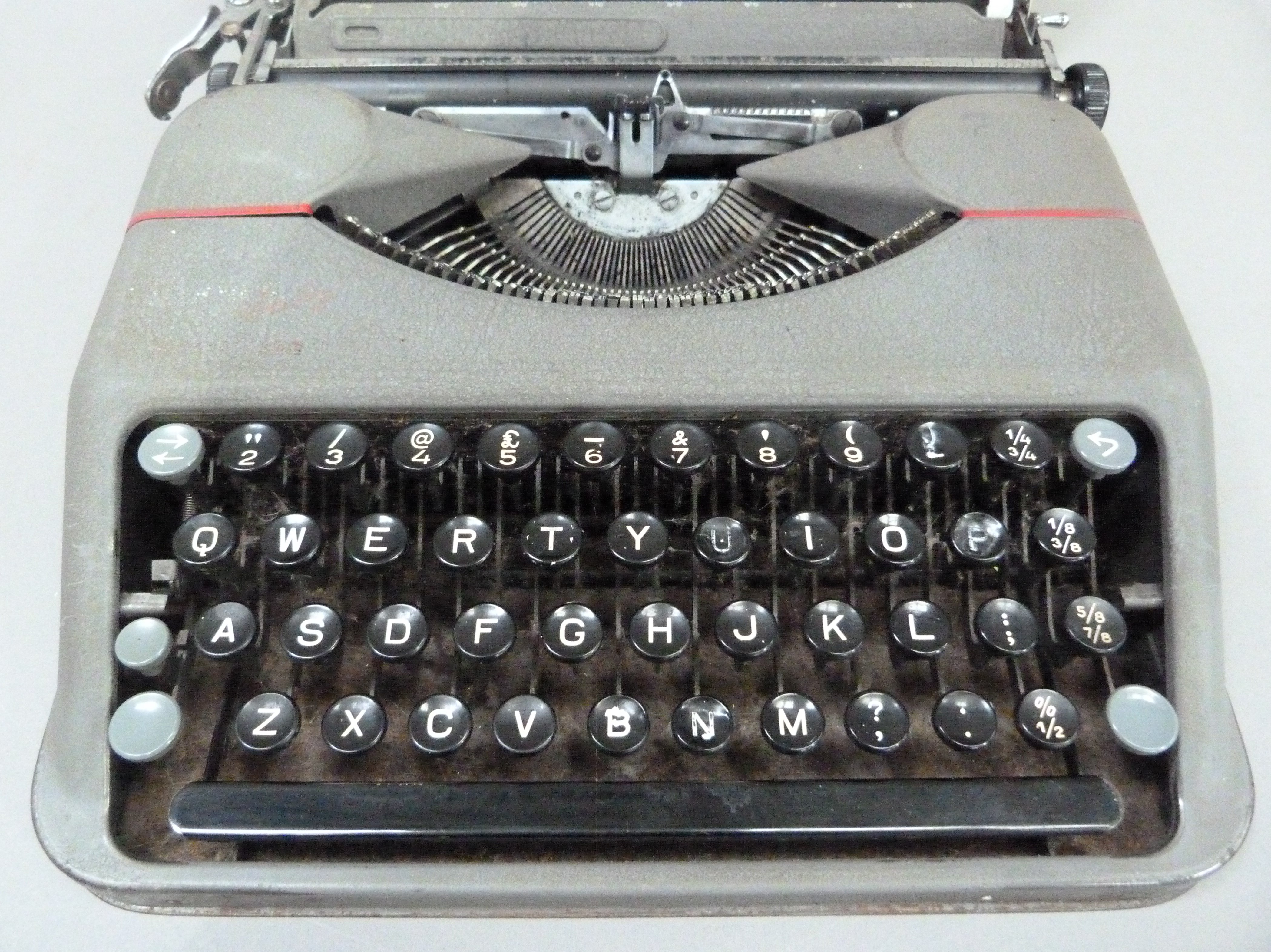 A Hermes portable typewriter by Paillard in grey metal case