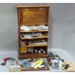 A cabinet of fly tying materials 1950s and later including, tools, colour threads, large selection