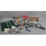 Painted wood cottage, barn, pigsty, hedges, rustic fencing, assorted lead figures, pony trap and