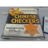 A Parker Brothers Chinese Checkers including board, six sets of coloured ceramic marbles (two