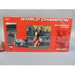 Minichamps 1:12 Ducati 996 Superbike 1999 and 2000 Carl Fogarty, both boxed, together with a display