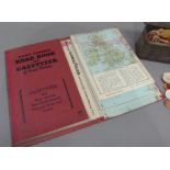 A vintage Daily Express Road Book and Gazetteer together with a tin of plain and coloured counters