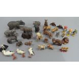 A small collection of wild animal models, c.1940, including tiger, lion, hippopotamus, monkey,