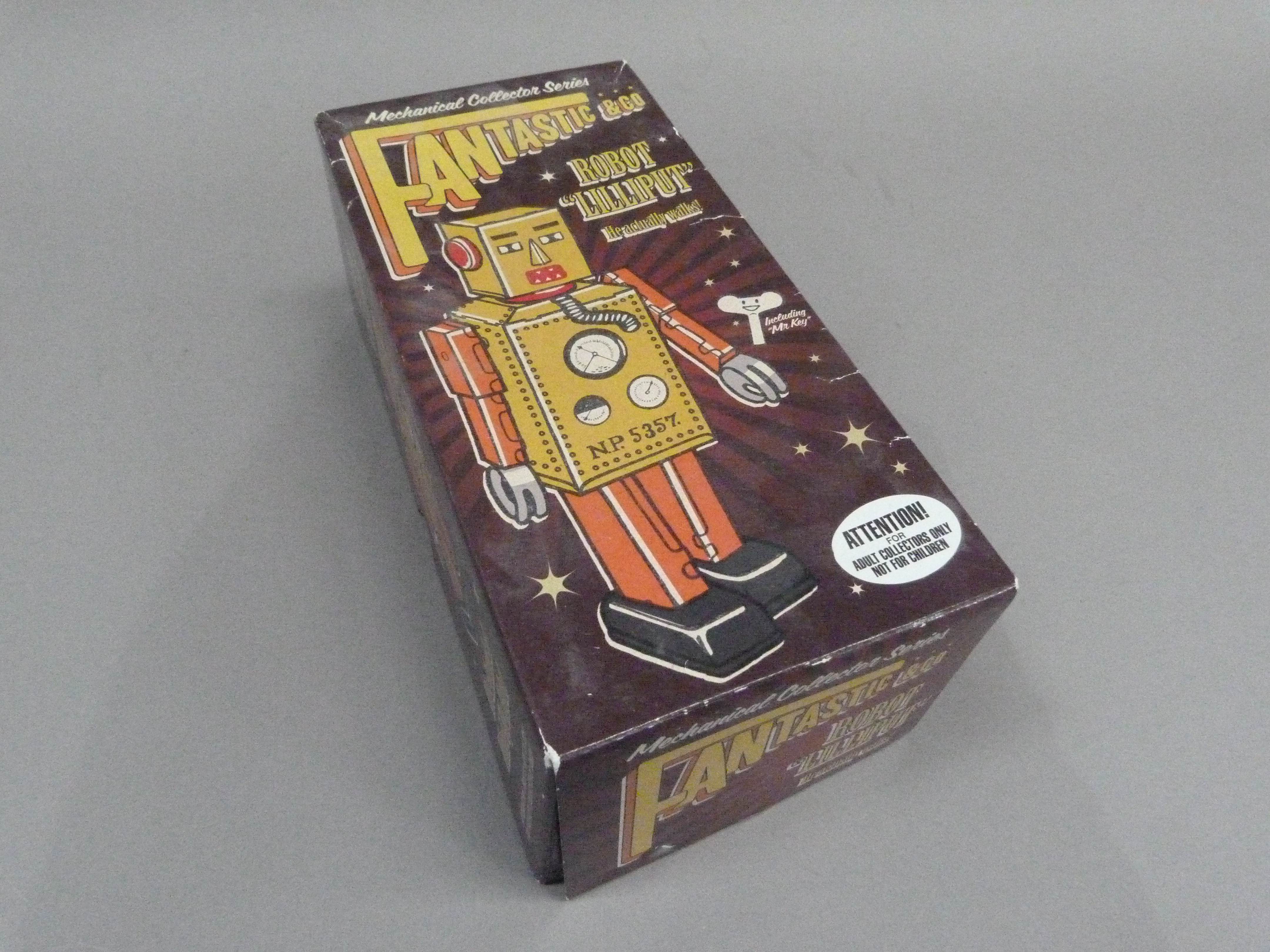 Robot Lilliput tin plate clockwork robot, yellow, 22cm, boxed