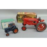 An International Harvester Farmall M Tractor, plastic model, in original box, together with a