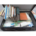 A collection of vintage European tourist maps and guide books contained in a suitcase, c.1950/60s