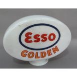 An 'Esso Golden' petrol pump head in white glass with blue and red, 39cm high x 52cm wide