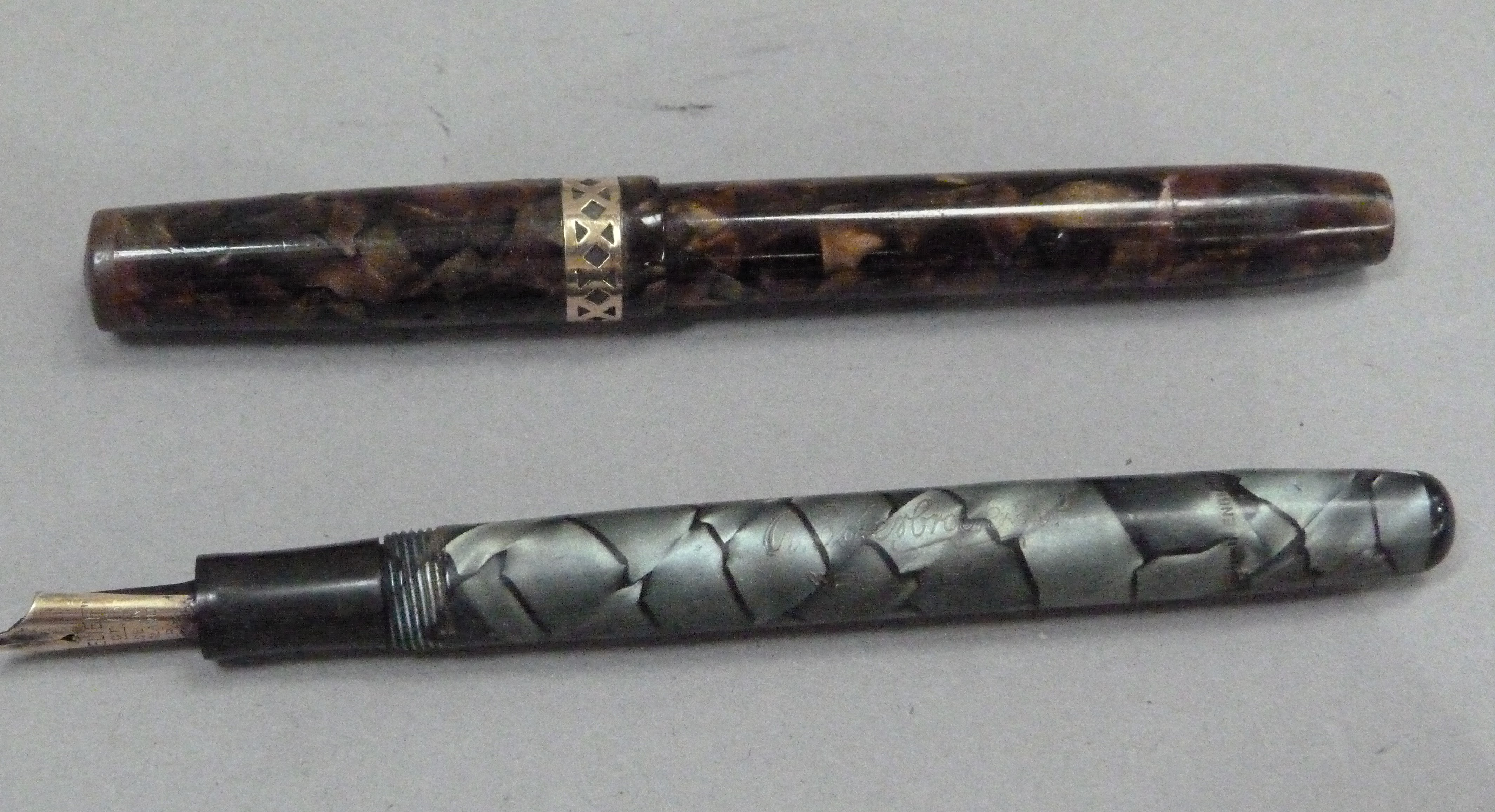 A Swan Visofil fountain pen by Mabie Todd & Co Ltd, 14ct gold nib, brown marbled case with yellow