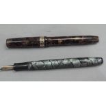 A Swan Visofil fountain pen by Mabie Todd & Co Ltd, 14ct gold nib, brown marbled case with yellow