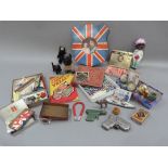 A miscellaneous collection of toys to include tin plate, die cast, a propellor gun, clockwork