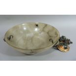 An early 20th century alabaster ceiling bowl with coppered metal rams face mask mounts, complete