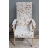 An upholstered open armchair on beech frame