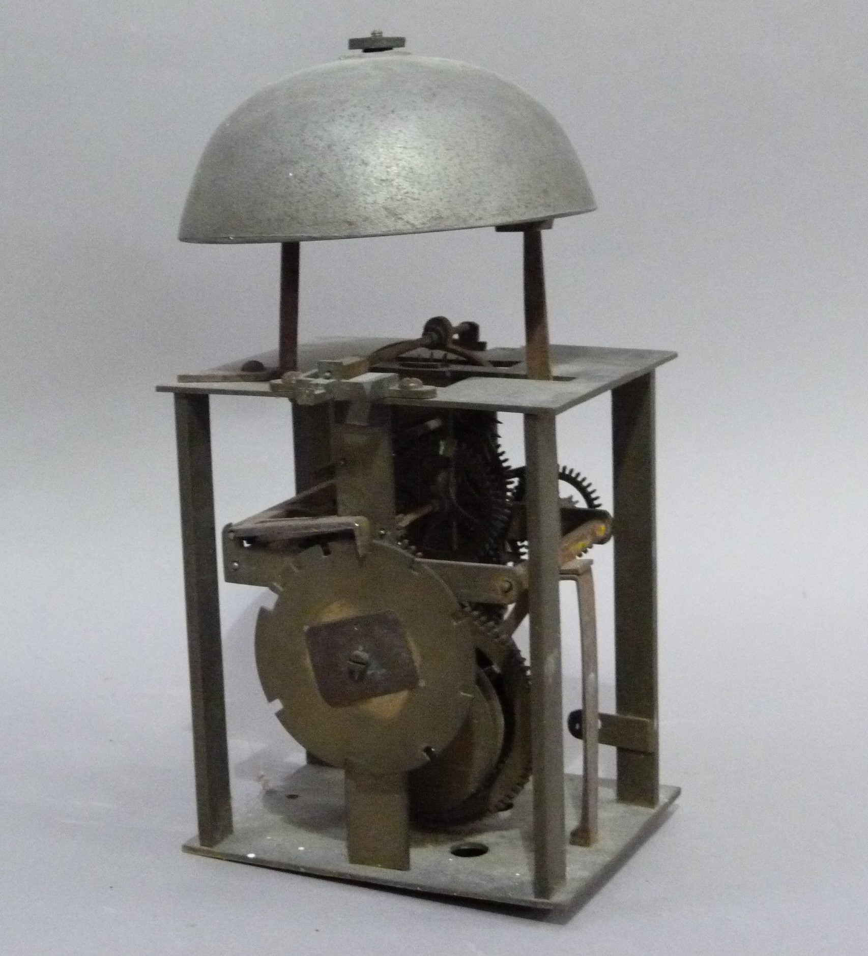 A post clock movement striking on a bell, brass, 27cm high (incomplete)