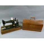 A Singer sewing machine in oak veneered case