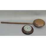 A carved oak framed anaroid barometer, together with a copper warming pan