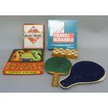 Vintage monopoly, Scrabble, Chinese checkers, two table tennis bats and a portable games box, etc