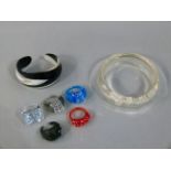Leahstein 'Horn' bangle, clear fish decorated bangle, and five various perspex rings