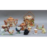 A three piece cottage tea service by Keele Street Pottery Company Ltd, a toast rack, biscuit barrel,