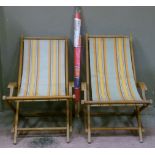 A pair of vintage deckchairs and a later windbreak