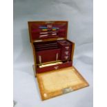 An Edwardian oak stationery box, red Morocco lined interior with stationery rack, three small