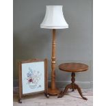 A beech standard lamp, a yew wood effect circular tripod table and a vintage oak framed fire