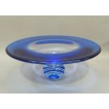 A blue to clear glass pedestal dish, the pedestal with a clear swirled blue band and etched