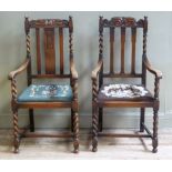 Two similar oak carver chairs having rail backs with barley twist uprights and legs on square