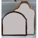 A walnut framed wall mirror of arched outline in the 18th century manner with bevelled glass,