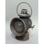 A Lucas No 74 King of the Road lamp, black japanned with convex lense, 35cm high